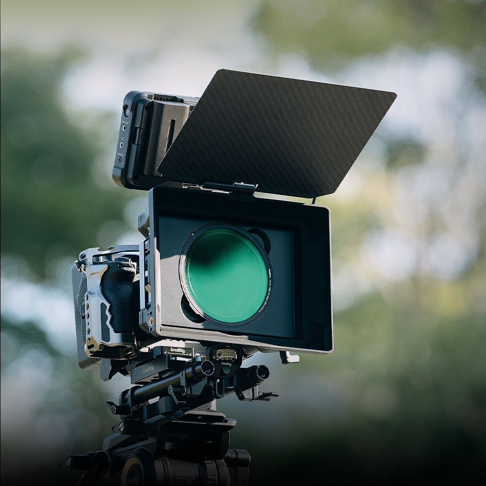 SmallRig Matte Box in outdoor use on camera rig — CPL filter attached and carbon-fibre flag open for flare control.