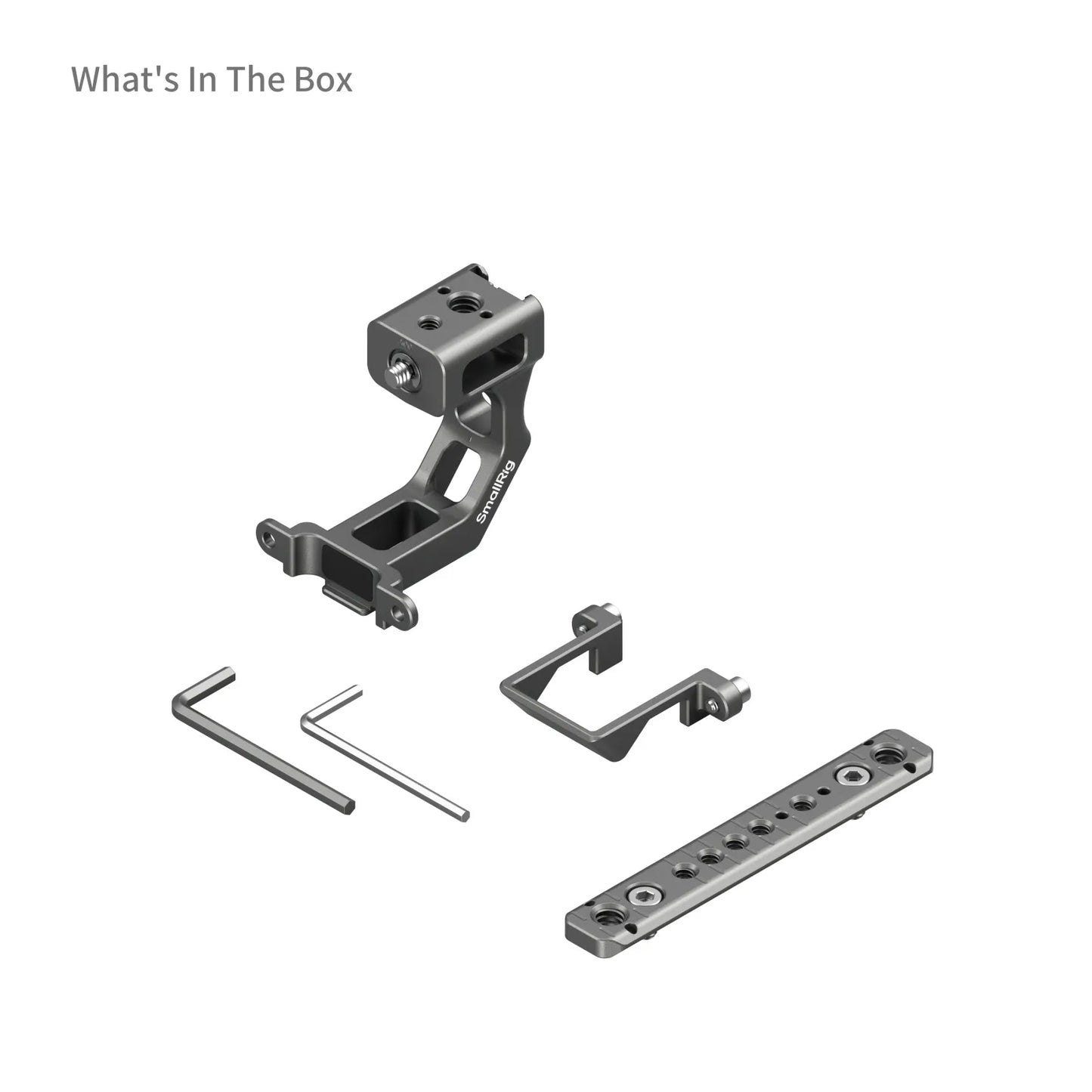 Flat-lay product shot showing all included components in the Extension Mount Plate Kit box: mounting bracket, top plate, two Allen keys, and extension adapter.