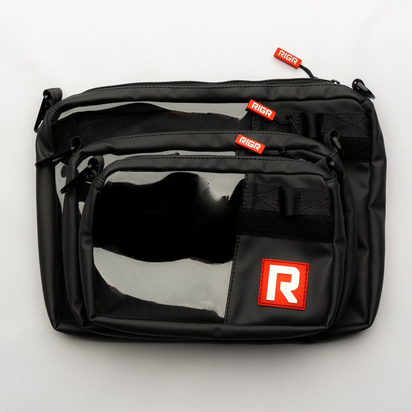 Multiple RIGR StakPak pouches stacked together, demonstrating modular storage and size.