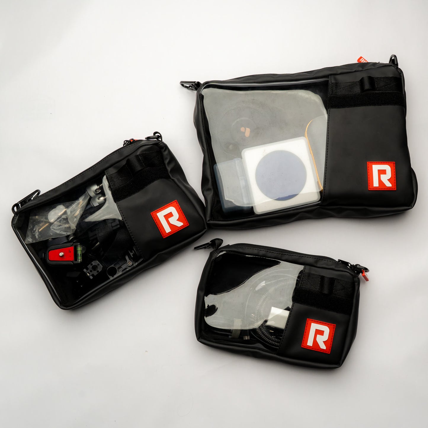 Overhead shot of multiple RIGR StakPak bags arranged with various filmmaking gear.
