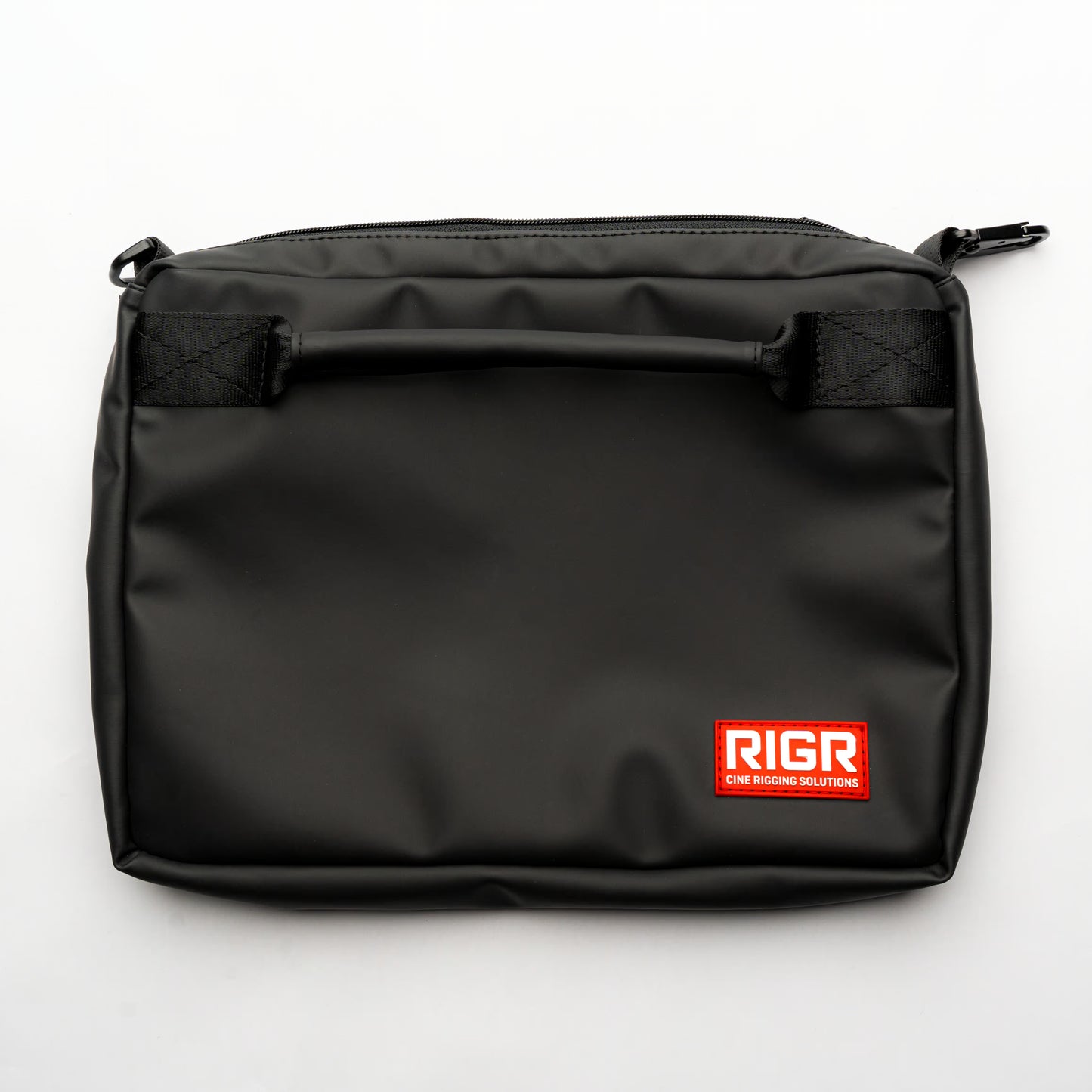RIGR StakPak gear bag rear end shown flat on surface, highlighting compact rectangular design.