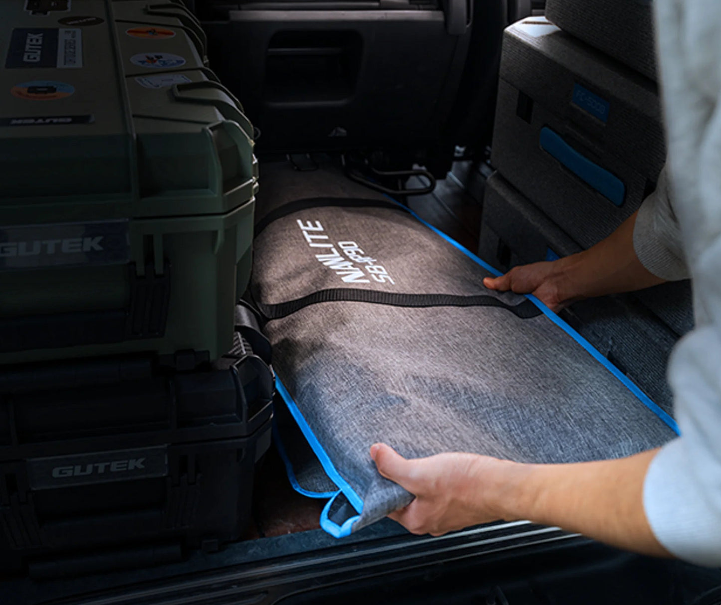 Nanlite Rapid 120 and Rapid 90 softbox combo packed flat in a vehicle with production gear for transport