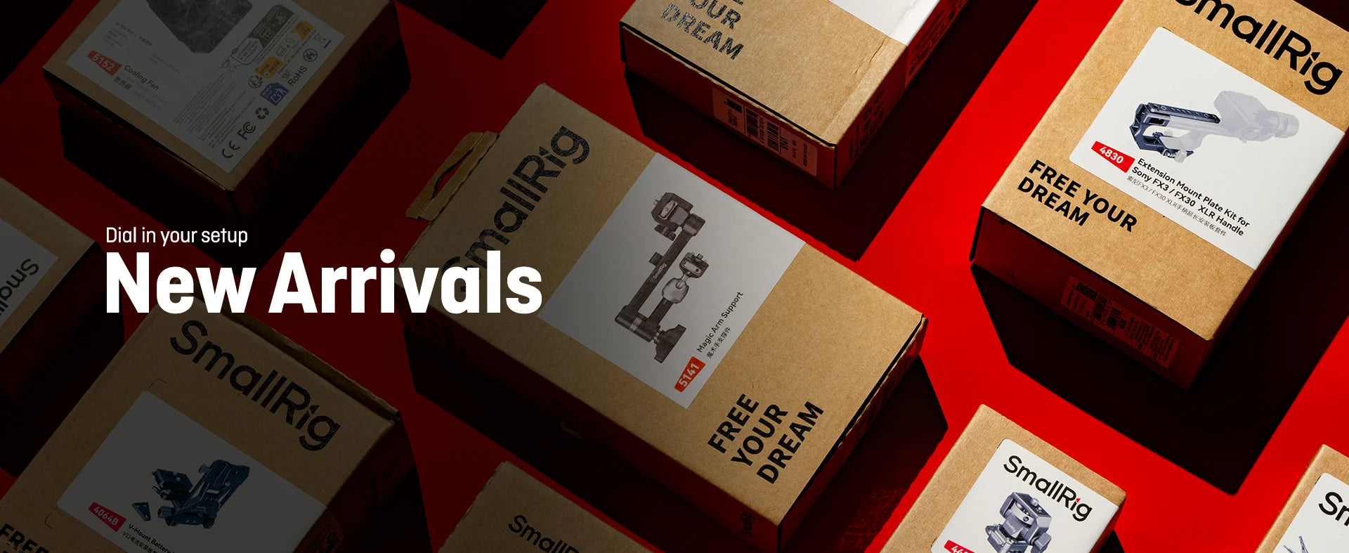 Unopened boxes of SmallRig filmmaking gear arranged on a red surface, showcasing new stock and camera rig accessories.