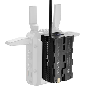 Rear view of the SmallRig dummy battery unit showing dual NP-F outputs and voltage display screen.