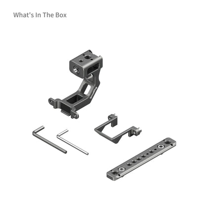 Flat-lay product shot showing all included components in the Extension Mount Plate Kit box: mounting bracket, top plate, two Allen keys, and extension adapter.