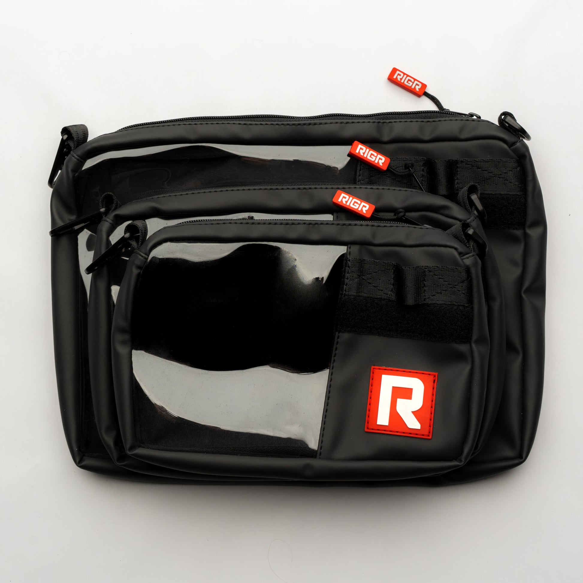 Multiple RIGR StakPak pouches stacked together, demonstrating modular storage and size.