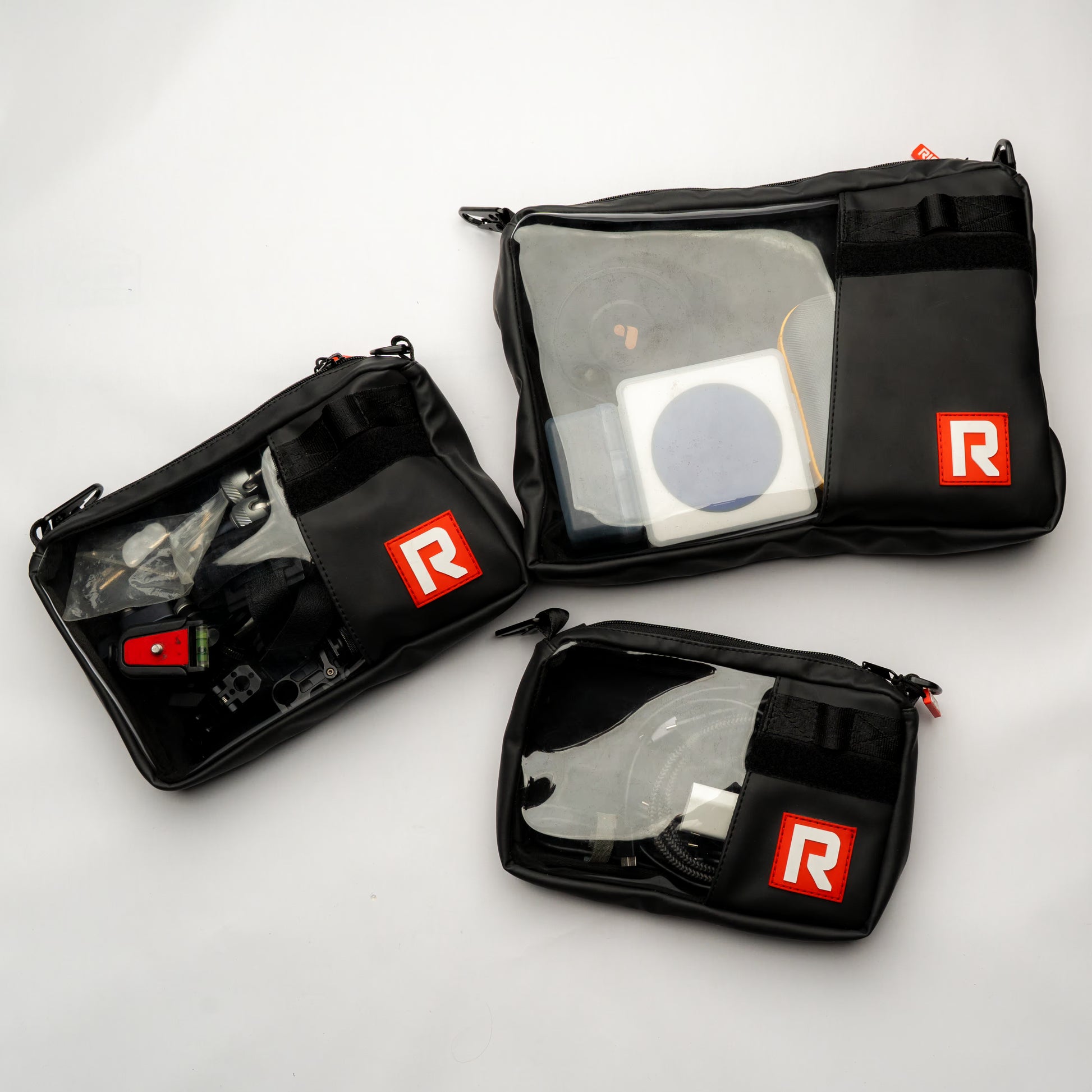 Overhead shot of multiple RIGR StakPak bags arranged with various filmmaking gear.