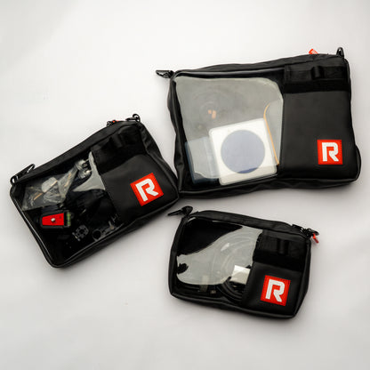 Overhead shot of multiple RIGR StakPak bags arranged with various filmmaking gear.