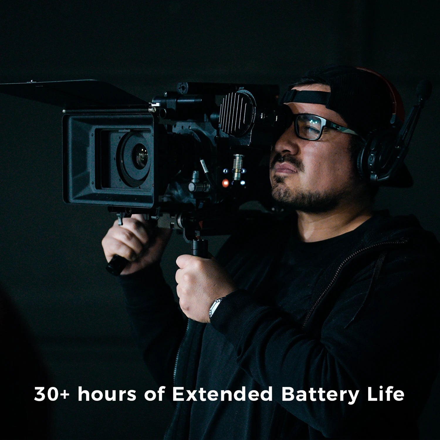 Camera operator wearing Accsoon wireless intercom headset highlighting 30 plus hours extended battery life for full shooting days