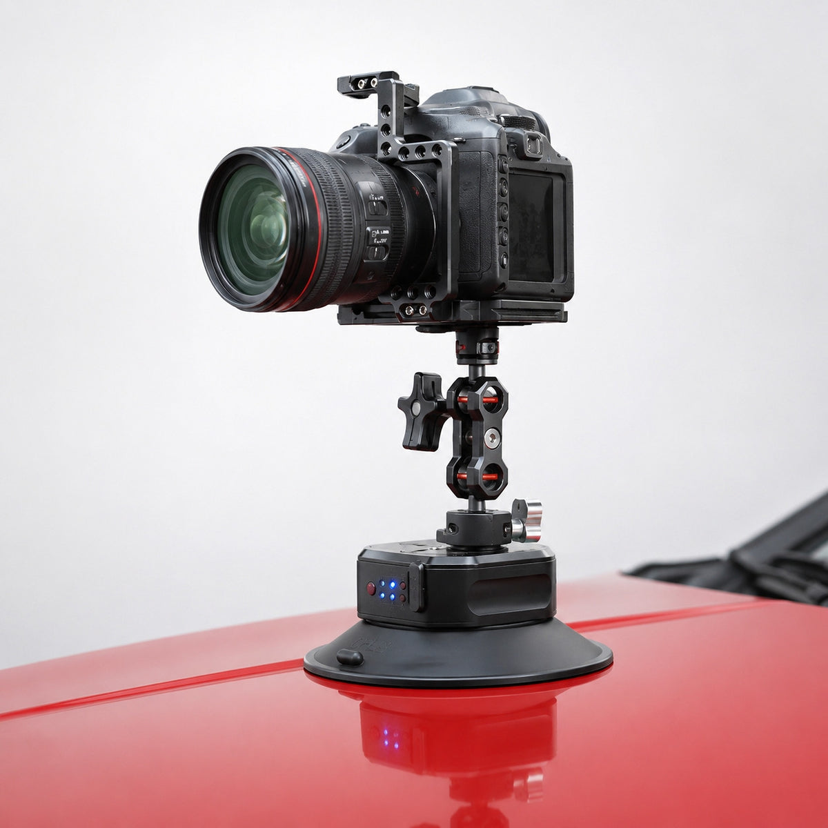 DigitalFoto SNIPER-EPUCK6 electric suction cup holding a caged camera on a car bonnet