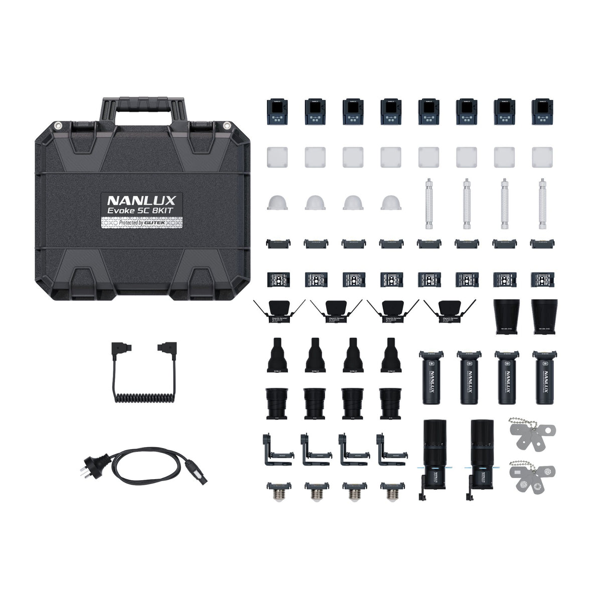 Flat-lay overhead view of opened case with all eight lights, magnetic accessories, diffusers, domes, barndoors, batteries, cables, and small fixtures displayed in organized rows.