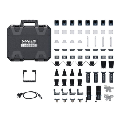 Flat-lay overhead view of opened case with all eight lights, magnetic accessories, diffusers, domes, barndoors, batteries, cables, and small fixtures displayed in organized rows.