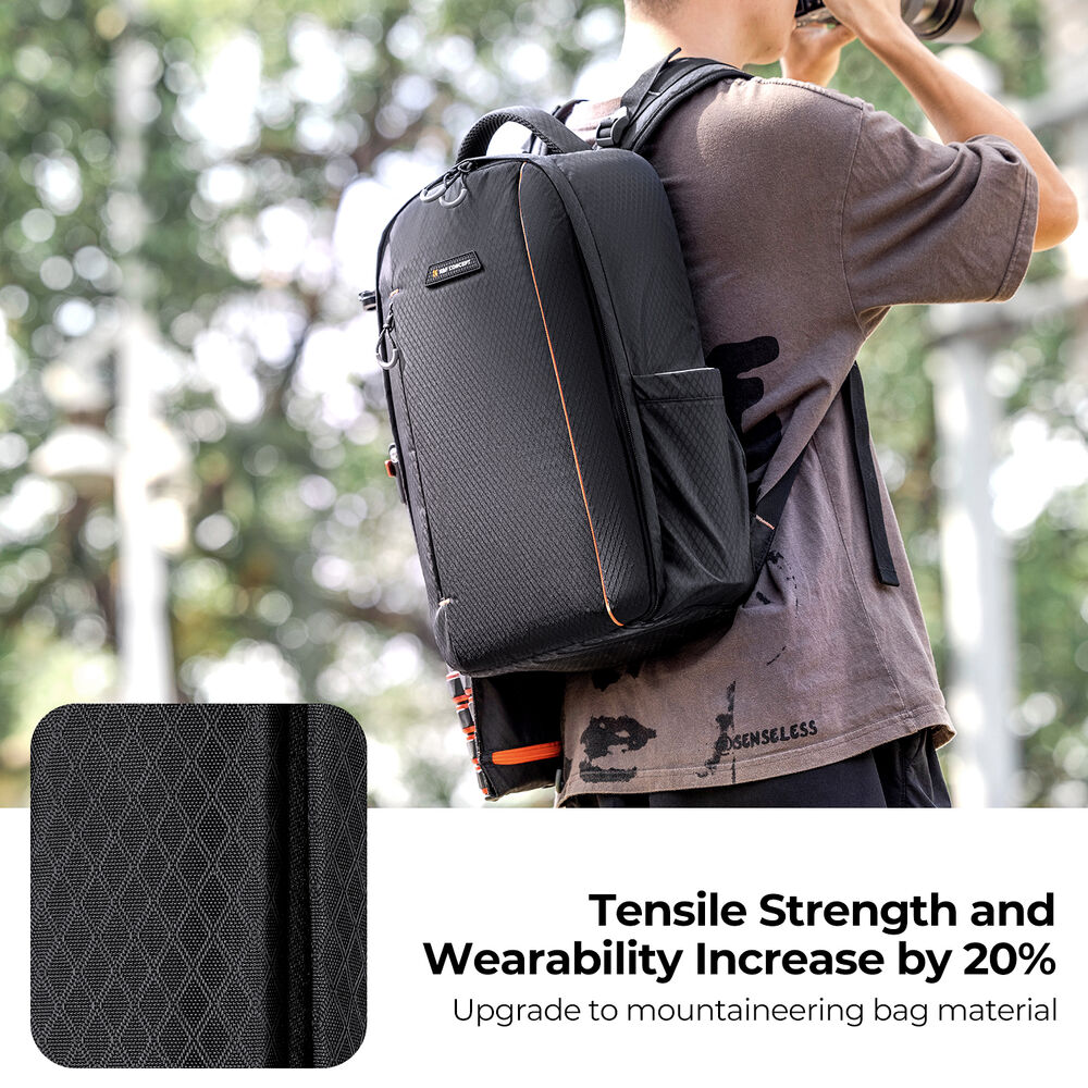 Photographer wearing the K&F Classic-Shooter camera backpack outdoors, demonstrating lightweight build and durable nylon exterior.