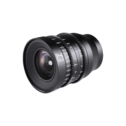 Laowa 14mm T2.6 positioned at oblique angle emphasizing the large front glass element, focus scale, and T2.6 designation.