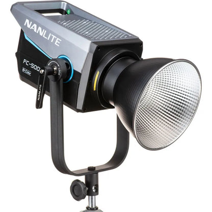 Nanlite FC-500B bi-colour LED spotlight mounted on a stand with reflector attached, angled three-quarter front view.