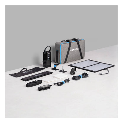 Full PavoSlim 240C kit displayed on white surface: control unit, gray padded case with blue trim, two panel sections with softbox frames, lens elements, cables, power pack, and accessories arranged for inventory reference.