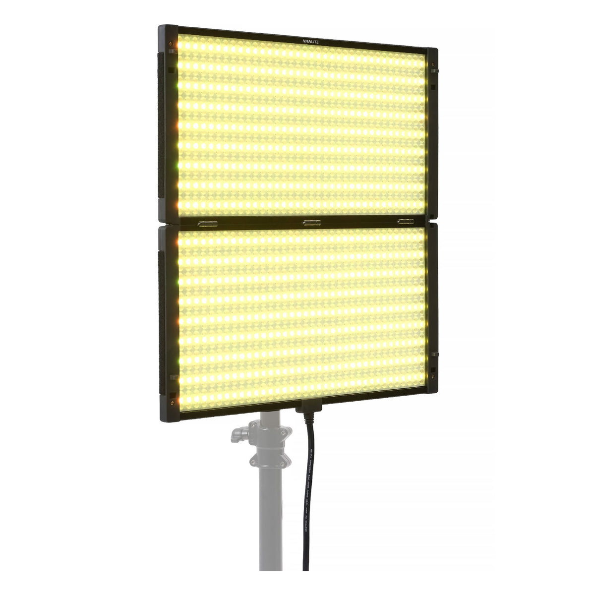 Two stacked PavoSlim 240C panels emitting warm yellow-tungsten light, demonstrating dual-unit modular setup and color temperature control.