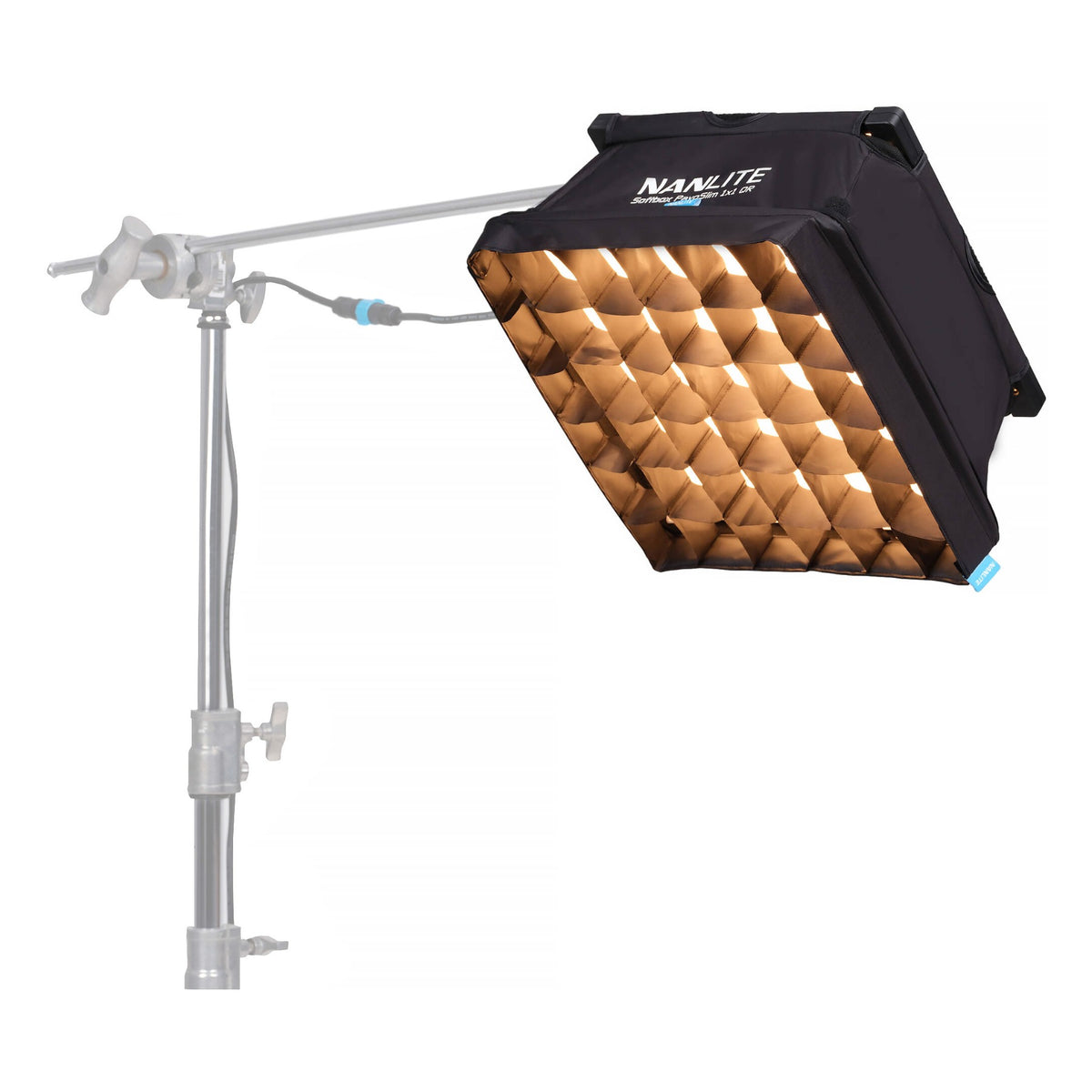 Same LED panel mounted on boom arm with warm-toned folding reflector element beside it, showing warm color output and mounting capability.