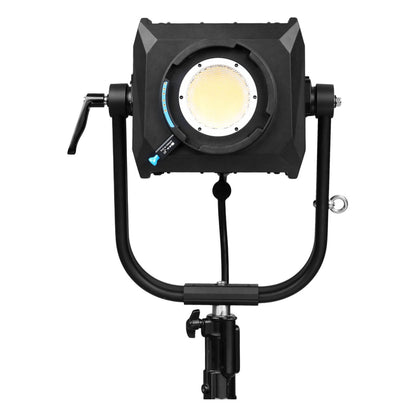 NANLUX Evoke 2400B spot light mounted on stand with lamp illuminated, showing bright warm color temperature and square barndoor reflector assembly.