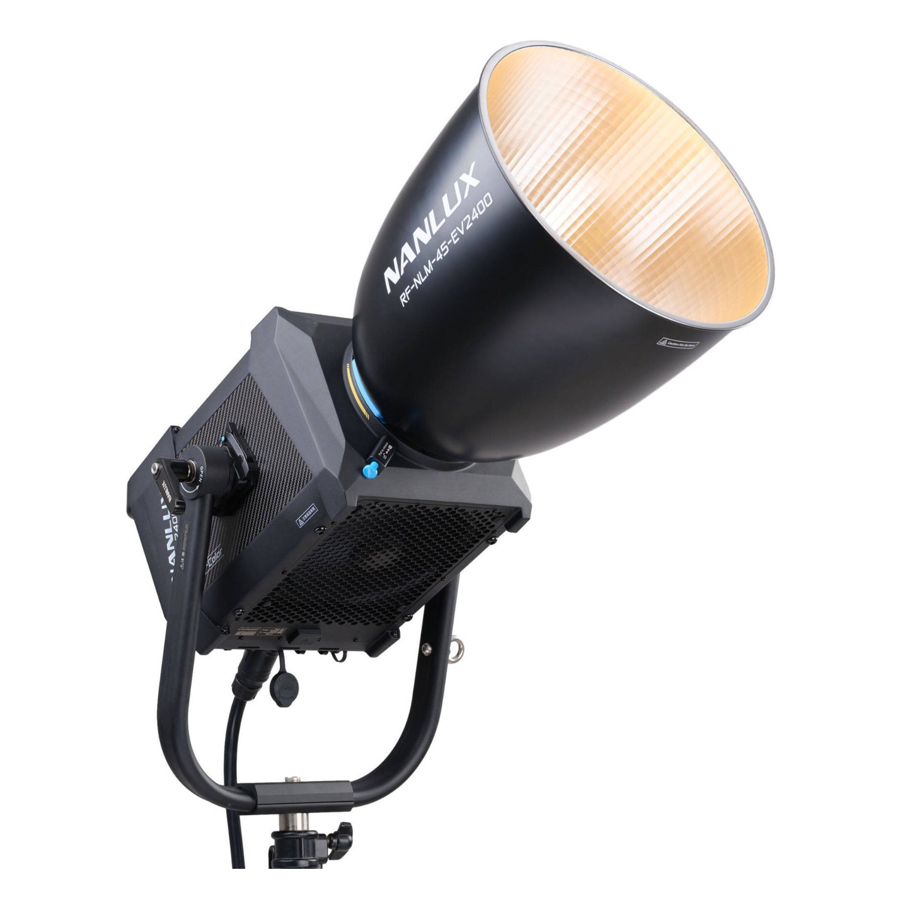 NANLUX Evoke 2400B with reflector tilted at working angle, illuminated showing warm bi-color output and reflector interior ribbed texture.