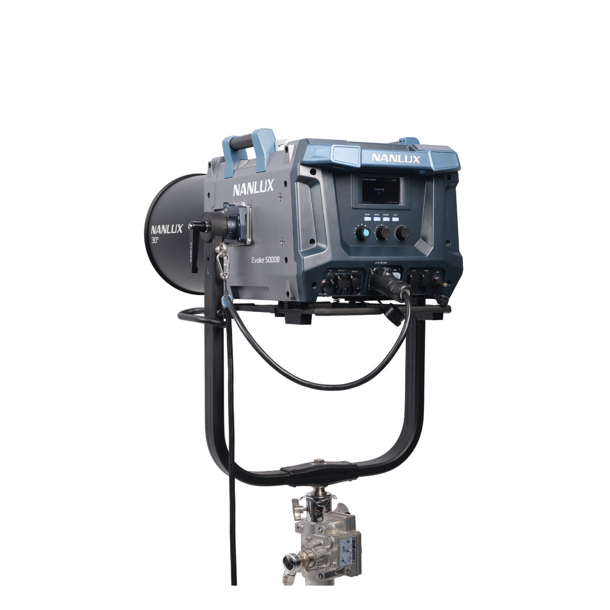 NANLUX Evoke 5000B with 30° lens attachment mounted on stand, photographed from the rear to show the control panel, back connectors, and cable routing alongside the focused lens optic.
