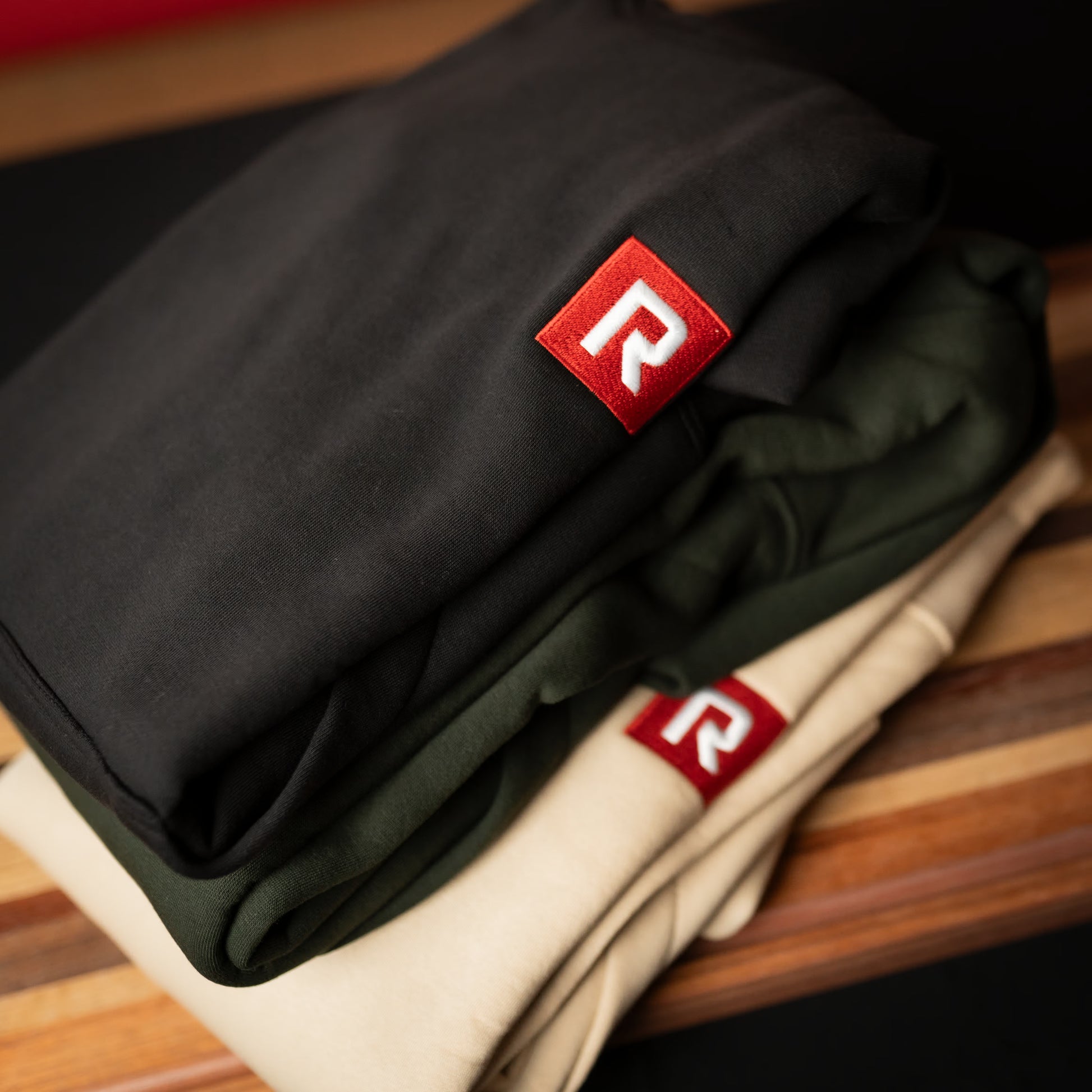 RIGR Heavyweight Hoodie colour options in black forest green and sand
