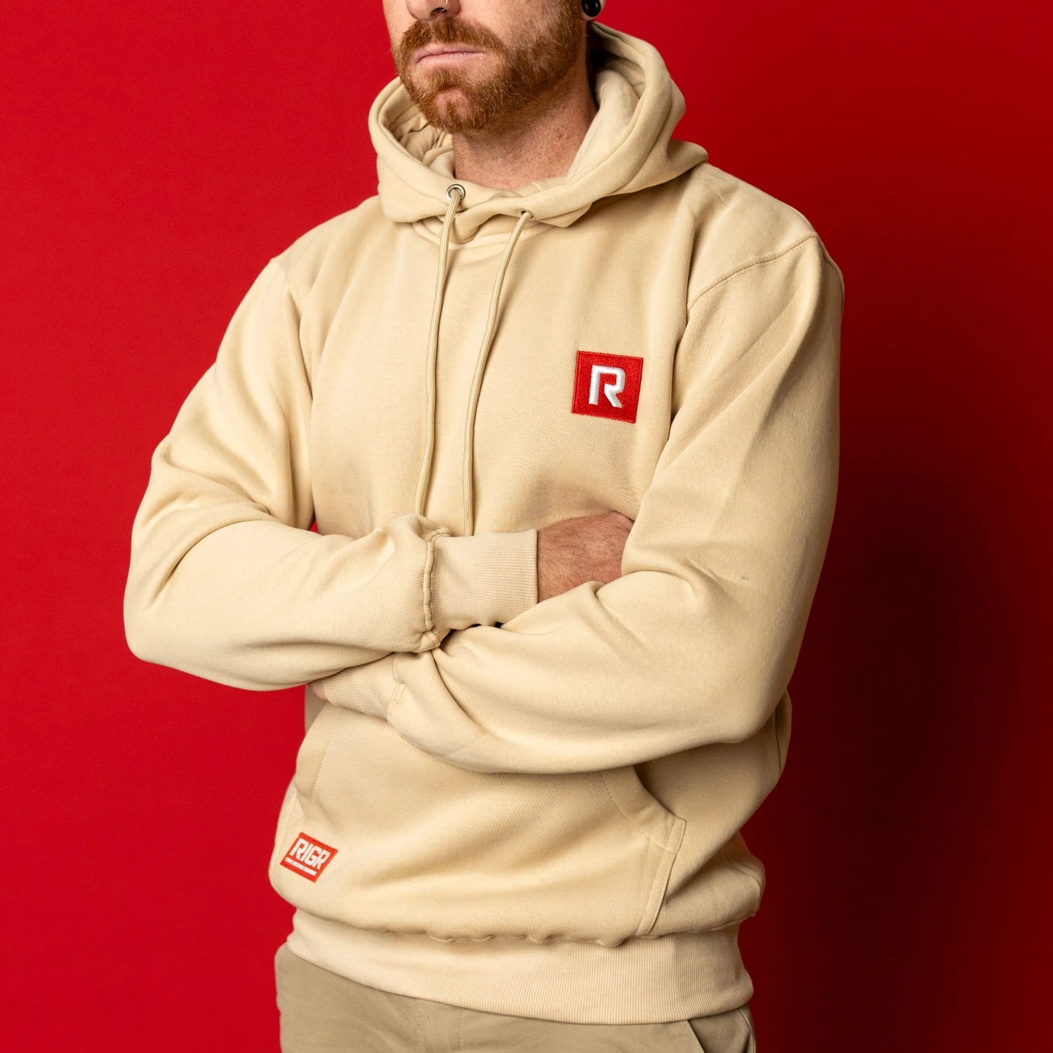 Angled view of RIGR Heavyweight Hoodie in sand