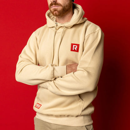 Angled view of RIGR Heavyweight Hoodie in sand